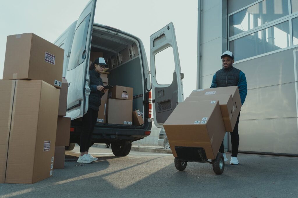 a-man-and-a-woman-working-for-a-delivery-company-6169668 A Man and a Woman Working for a Delivery Company